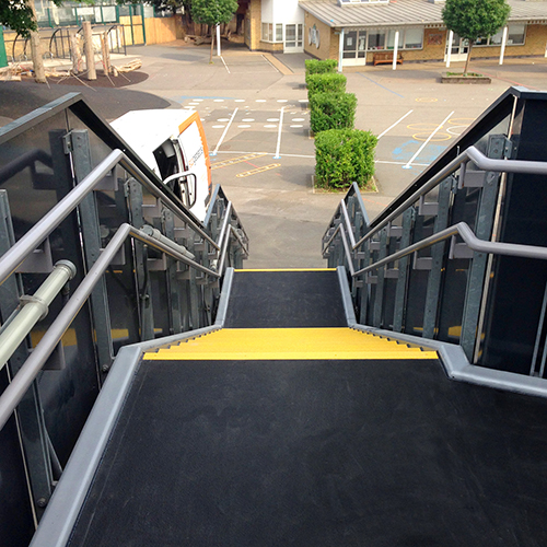 Completed stairs, ramps and walkways for a school installation.