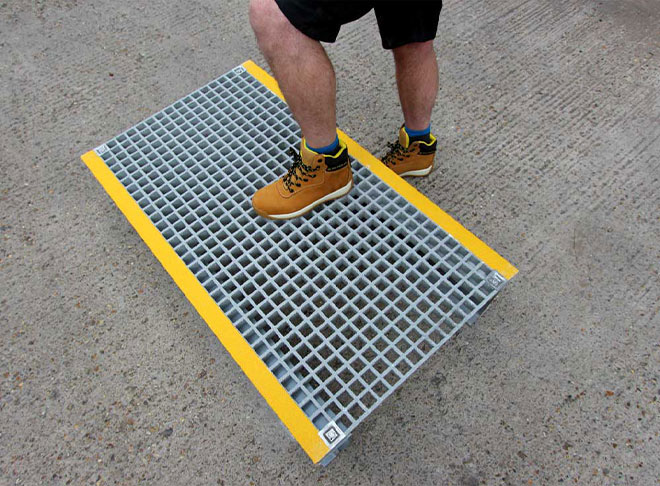 GRP grating platform for pipes, cables and trip hazards. GRP grating platform for pipes, cables and trip hazards.