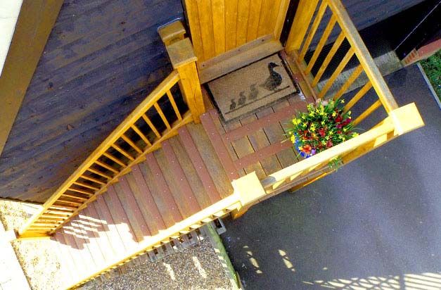 Wooden staircase flat entrance, made safer with grp strips. Wooden staircase flat entrance, made safer with grp strips.