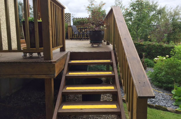 Yellow non-slip decking strips for garden steps. Yellow non-slip decking strips for garden steps.