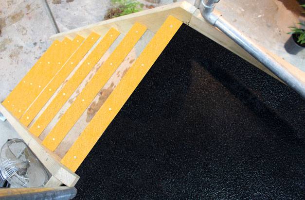 Slippery timber platforms made safe with floor sheets and stair nosing. Slippery timber platforms made safe with floor sheets and stair nosing.