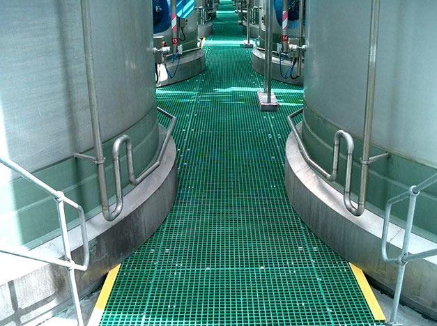 Chemical resistant and slip resistant GRP Grating installation for a brewery and distillery floors. The floors must withstand impact from kegs and barrels, trolleys and forklifts. Chemical resistant and slip resistant GRP Grating installation for a brewery and distillery floors. The floors must withstand impact from kegs and barrels, trolleys and forklifts.