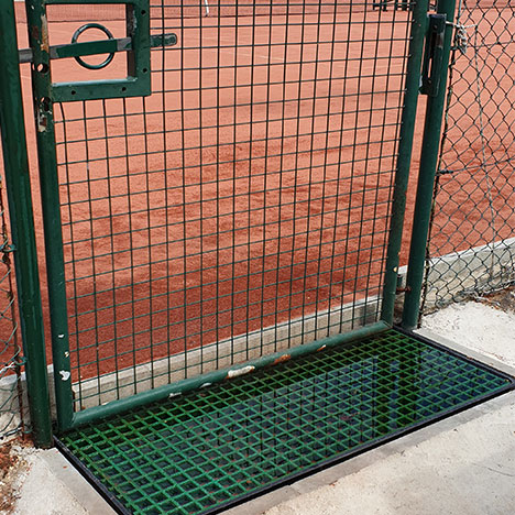 “GRP grid was cut-to-size to fit a plastic tray and then filled with water. Used as water batch to remove sand from players shoes after exiting tennis clay courts.“ H Thuillier. “GRP grid was cut-to-size to fit a plastic tray and then filled with water. Used as water batch to remove sand from players shoes after exiting tennis clay courts.“ H Thuillier.