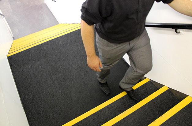 Anti-slip and high-vis stair treads and landing covers installation. Anti-slip and high-vis stair treads and landing covers installation.