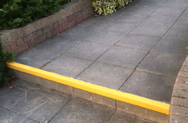 Yellow stair nosings provide contrast, highlighting the step edge. Yellow stair nosings provide contrast, highlighting the step edge.