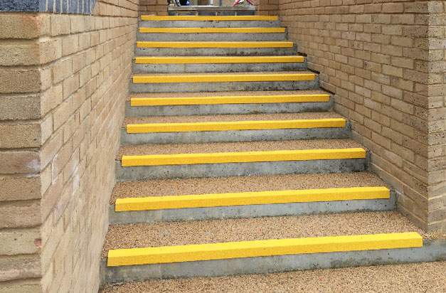 Anti slip stair nosing public stairway installation. Anti slip stair nosing public stairway installation.