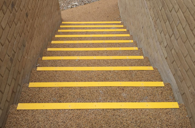 Anti slip stair nosing laid on a resin bound surface. Anti slip stair nosing laid on a resin bound surface.