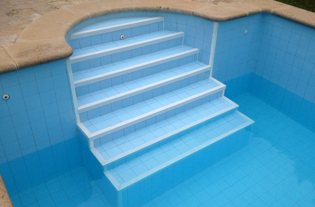 On this swimming pool the old ceramic tile nosing was starting to deglaze. The application of anti slip stair nosings made an easy and relatively quick way to put this right. Not having to remove old tiles and risk damage to tiles or substrate was a benefit, as well as the improved slip resistance on the steps. On this swimming pool the old ceramic tile nosing was starting to deglaze. The application of anti slip stair nosings made an easy and relatively quick way to put this right. Not having to remove old tiles and risk damage to tiles or substrate was a benefit, as well as the improved slip resistance on the steps.
